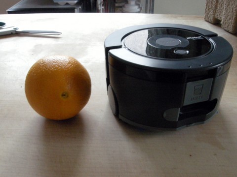 Scooba 230 with an orange for scale