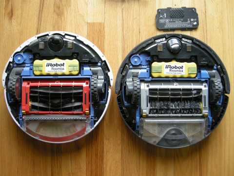 Roombas side by side with the bottom off